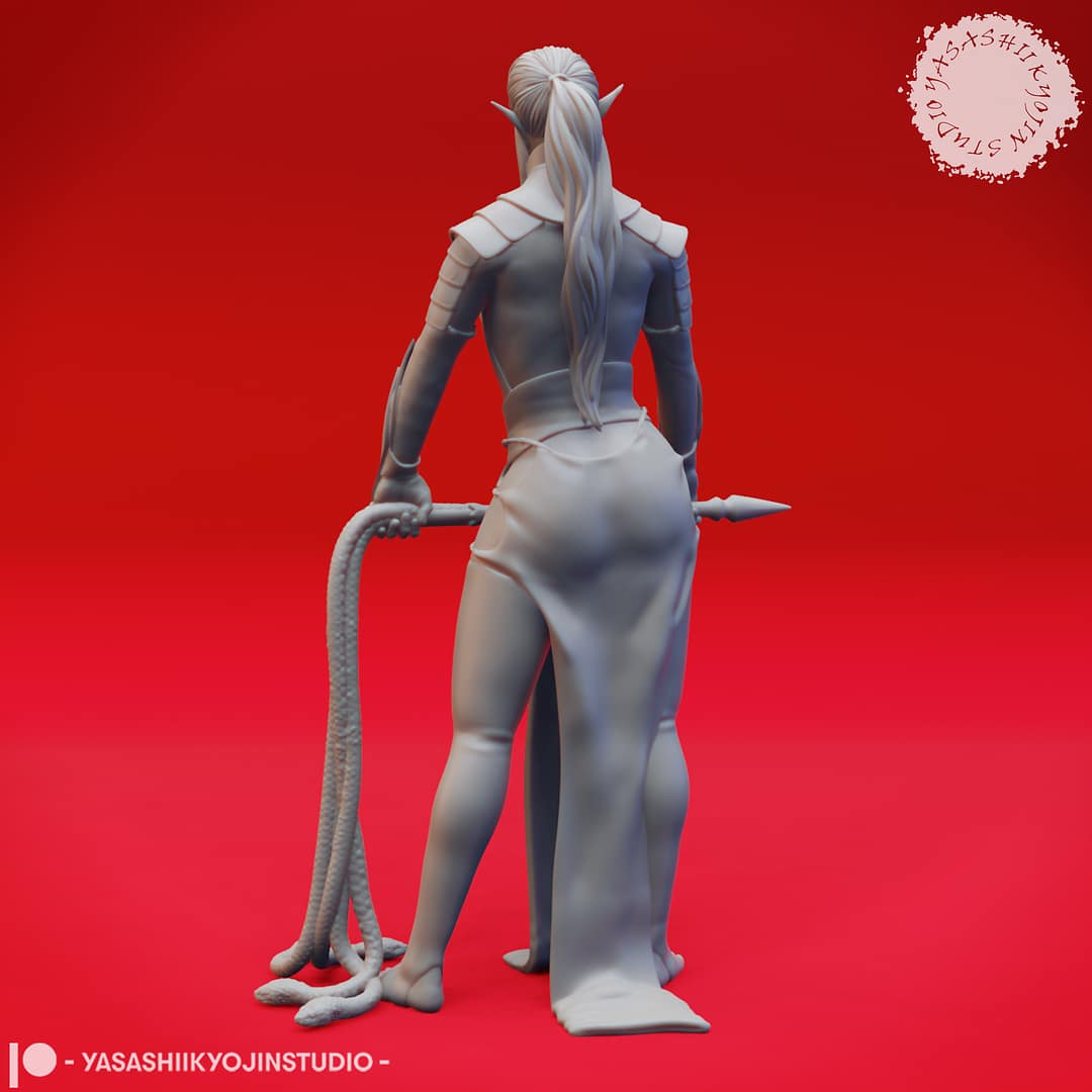 A grayscale resin miniature of a drow elf warrior with long hair, dual curved swords, and layered elven armour