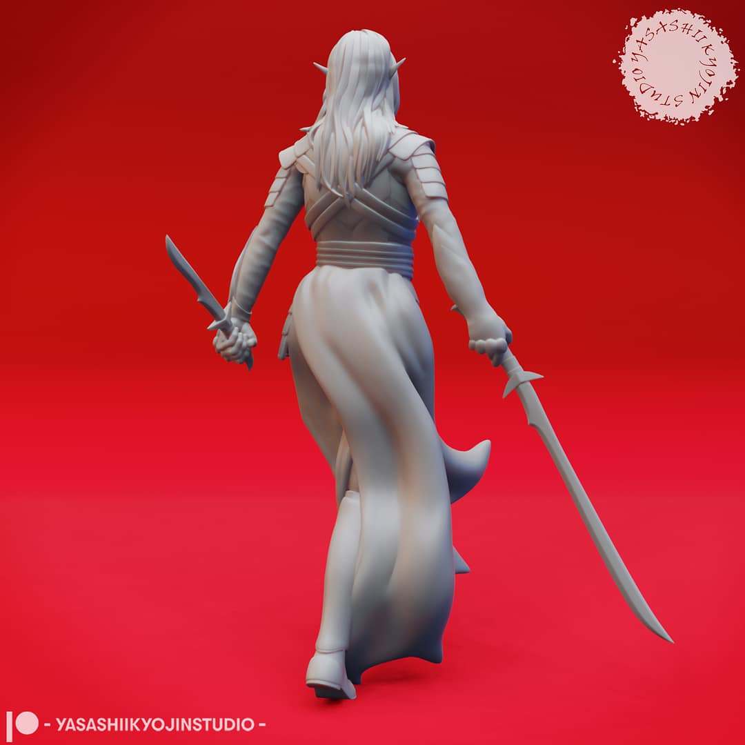 A grayscale resin miniature of a drow elf warrior with long hair, dual curved swords, and layered elven armour