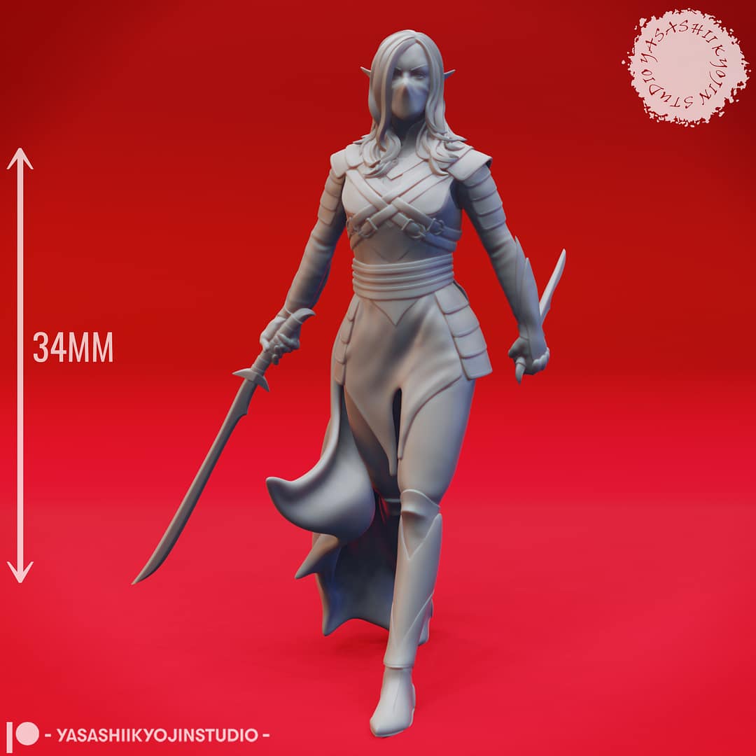 A grayscale resin miniature of a drow elf warrior with long hair, dual curved swords, and layered elven armour