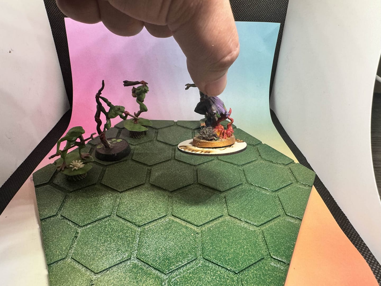 “Wooden laser-engraved magnetized condition marker rings from Roll 4 Shenanigans, featuring various TTRPG conditions like Frightened, Stunned, Grappled, and Restrained, displayed in a scattered group.”