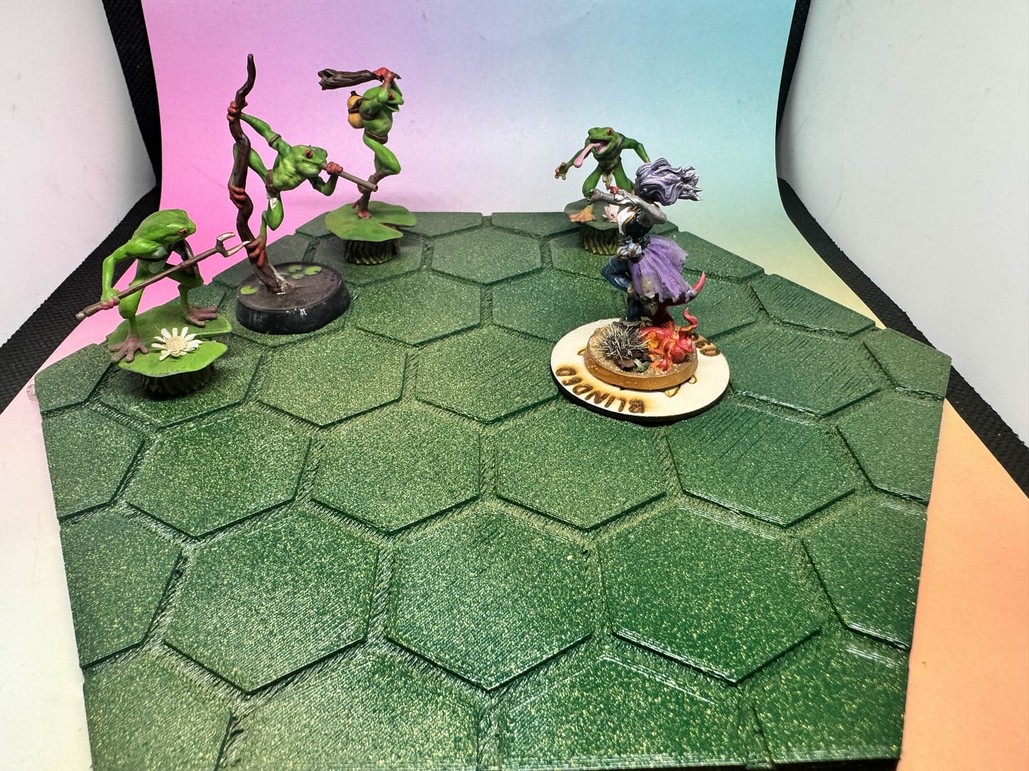 “Wooden laser-engraved magnetized condition marker rings from Roll 4 Shenanigans, featuring various TTRPG conditions like Frightened, Stunned, Grappled, and Restrained, displayed in a scattered group.”