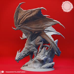 Ancient Red Dragon Miniature – Peak of Fire and Fury by Yasashii Kyojin Studio, shown mid-perch with wings unfurled and poised atop a craggy outcrop.