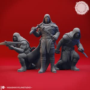 Bandit Miniature Set – Shadowy Rogues by Yasashii Kyojin Studio. Three resin miniatures of hooded bandits in combat poses—one crouching with a crossbow, one standing with a sword, and one advancing with a dagger