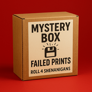 “Failed Prints Mystery Box filled with resin misprints and kitbash parts by Roll 4 Shenanigans.”