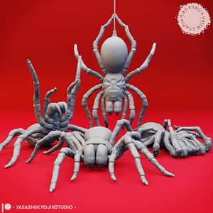 Five resin Giant Spider miniatures—Stalking, Defeated, Eggs, Hanging, and Rearing poses—featuring detailed legs, mandibles, and segmented bodies, sculpted by Yasashii Kyojin Studio and displayed against a red background